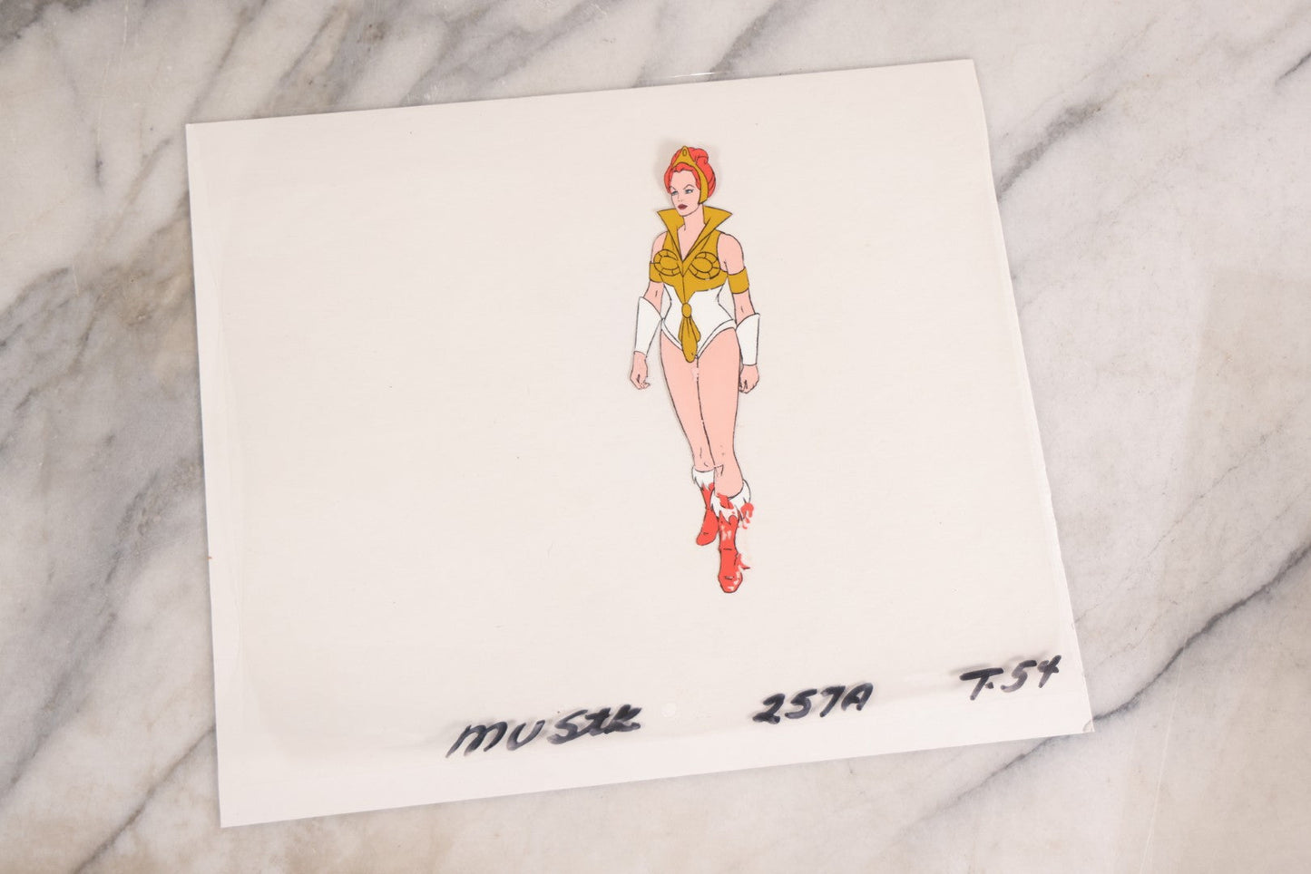 Lot 079 - Grouping Of Five Original Reverse-Painted Production Character Animation Cels On Celluloid From 1983 Cartoon "He-Man And The Masters Of The Universe," He-Man (2), Orko (2), And Teela (1)