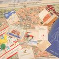 Lot 080 - Vintage European Tourism Ephemera Lot, Including 1938 French Dance Program, Double-Sided Fold Out Map Of Paris And Environs, Assorted Ephemera From 1939 Queen Mary Trip To England, And Paper Menu From "Cafe De La Paix"