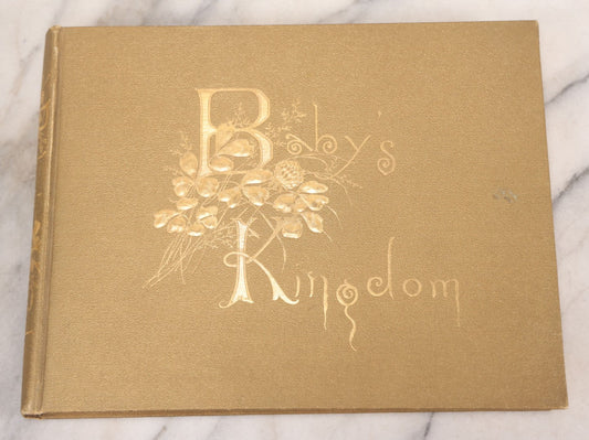 Lot 131 - "Baby's Kingdom" Antique Illustrated Baby Book With Gilt Embossed Clovers And Lettering On Cover, Gilt Foredge, Some Records Of Baby Harold Schenck, Born July 1892, With Calligraphy And Memos From Parents On 10+ Pages