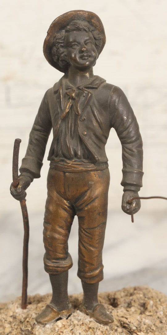 Lot 005 - Antique Bronze Figural Sculpture Of Young Fishing Boy With Walking Stick, Mounted On Natural Stone Base, Circa Late 19th Century, 8-1/2" H