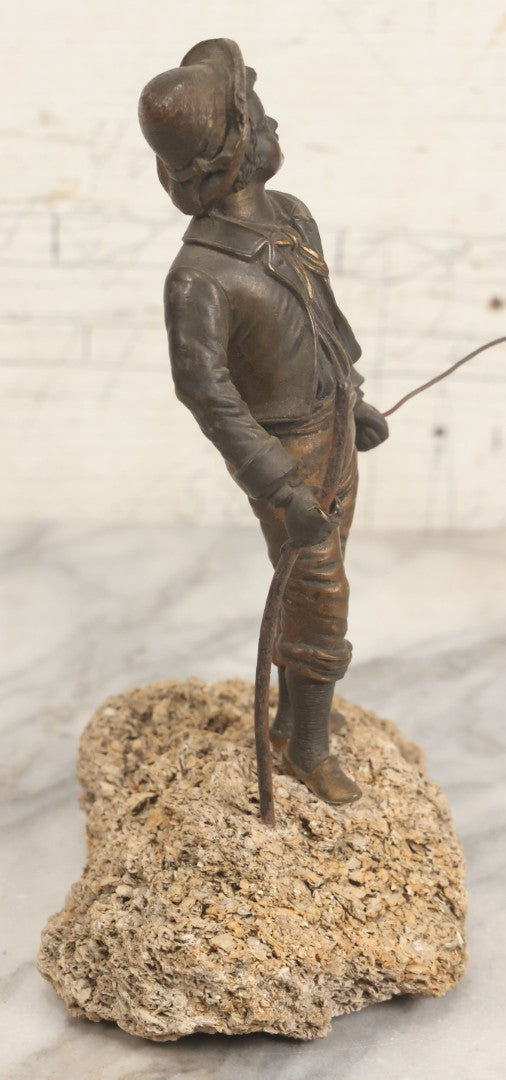 Lot 005 - Antique Bronze Figural Sculpture Of Young Fishing Boy With Walking Stick, Mounted On Natural Stone Base, Circa Late 19th Century, 8-1/2" H