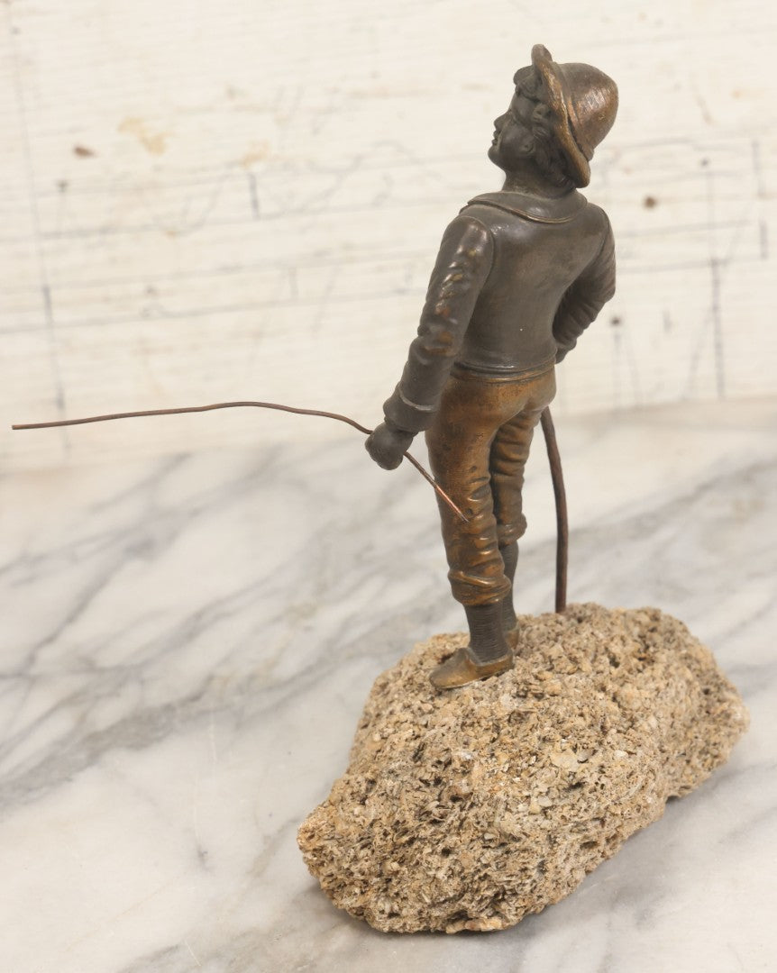Lot 005 - Antique Bronze Figural Sculpture Of Young Fishing Boy With Walking Stick, Mounted On Natural Stone Base, Circa Late 19th Century, 8-1/2" H