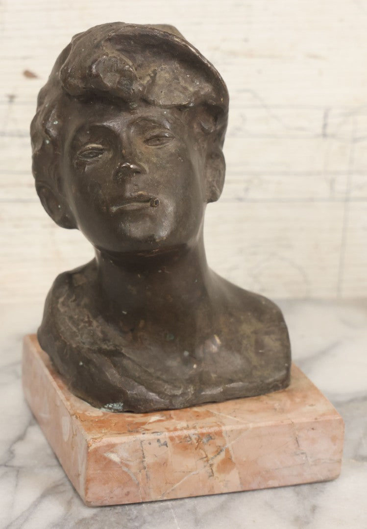 Lot 006 - Antique Spelter Bust Of Young Man With Tousled Hair, Cap, Smoking Cigarette Mounted On Marble Base, Hollow Form, Circa Early 20th Century, 7" H