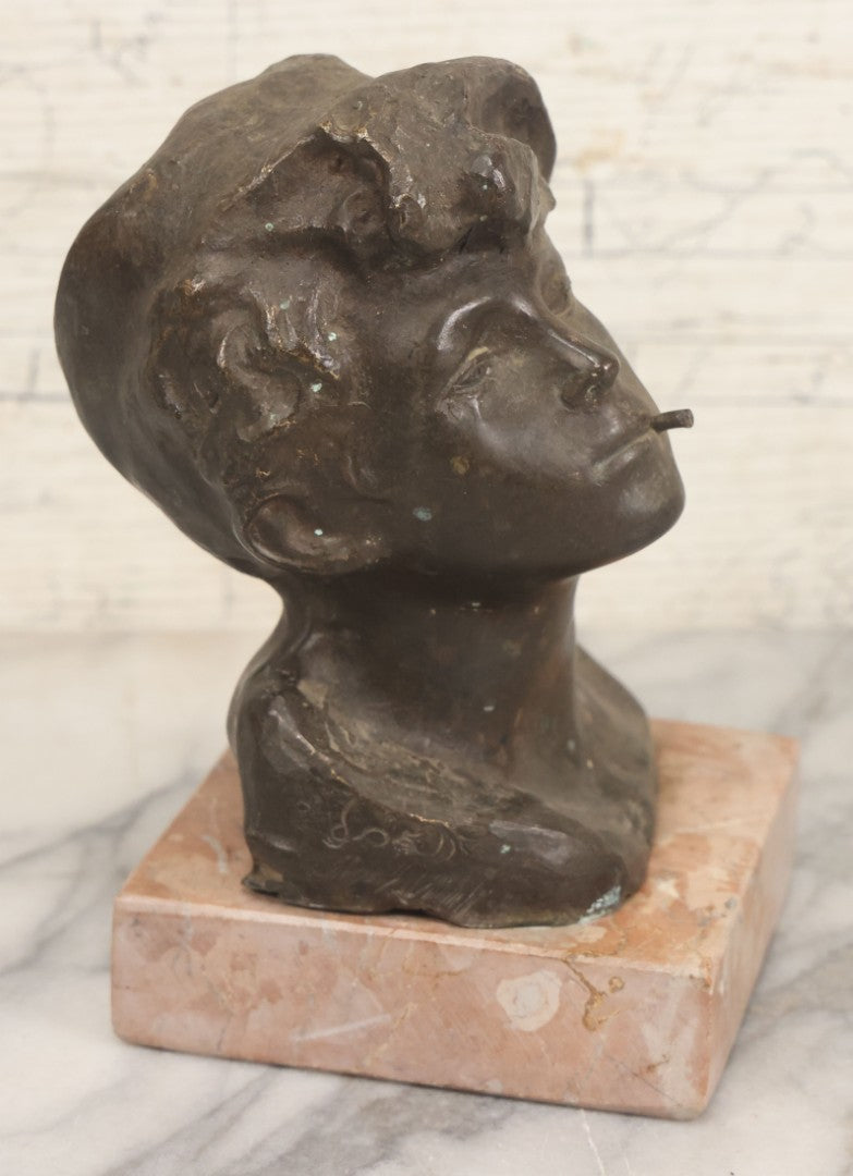 Lot 006 - Antique Spelter Bust Of Young Man With Tousled Hair, Cap, Smoking Cigarette Mounted On Marble Base, Hollow Form, Circa Early 20th Century, 7" H