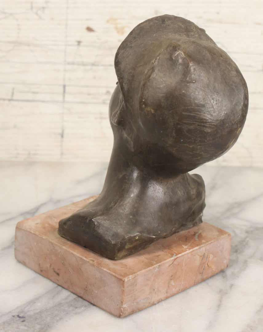 Lot 006 - Antique Spelter Bust Of Young Man With Tousled Hair, Cap, Smoking Cigarette Mounted On Marble Base, Hollow Form, Circa Early 20th Century, 7" H