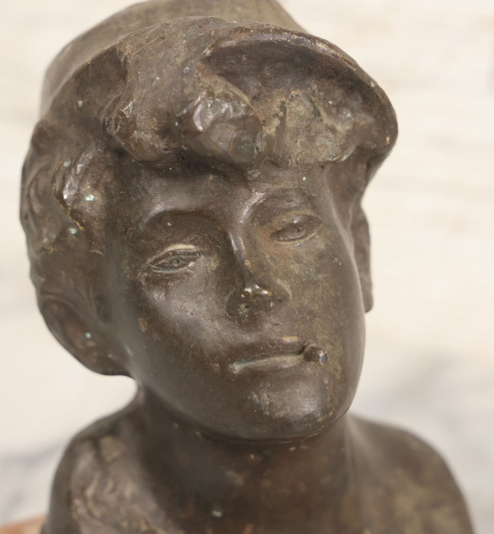Lot 006 - Antique Spelter Bust Of Young Man With Tousled Hair, Cap, Smoking Cigarette Mounted On Marble Base, Hollow Form, Circa Early 20th Century, 7" H