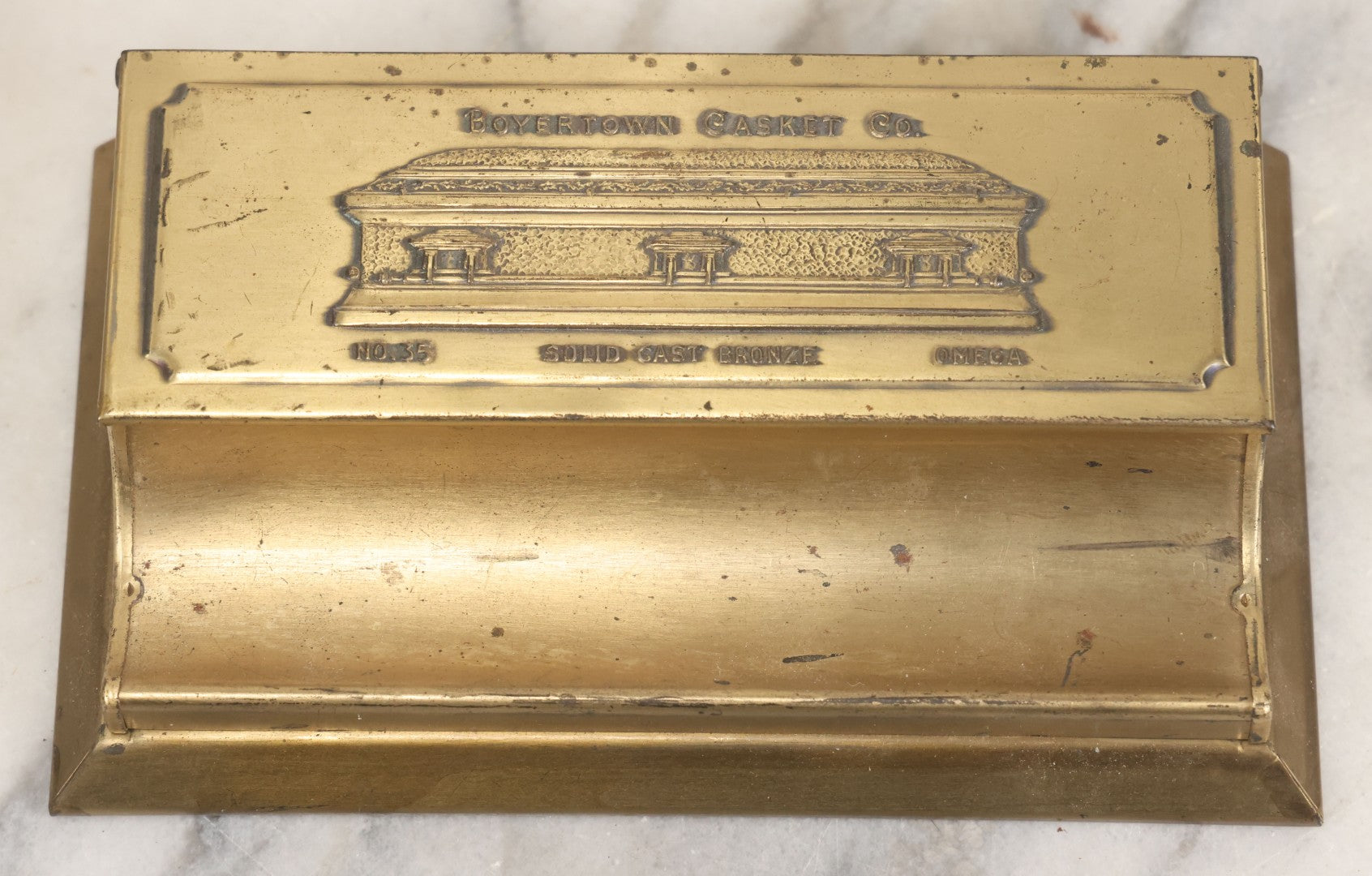 Lot 007 - Vintage Brass Advertising Desk Stamp Box And Pen Stand For Boyertown Casket Co., Promoting No. 35 Solid Cast Bronze Omega Casket Line, With Internal Paper Insert Advertisement