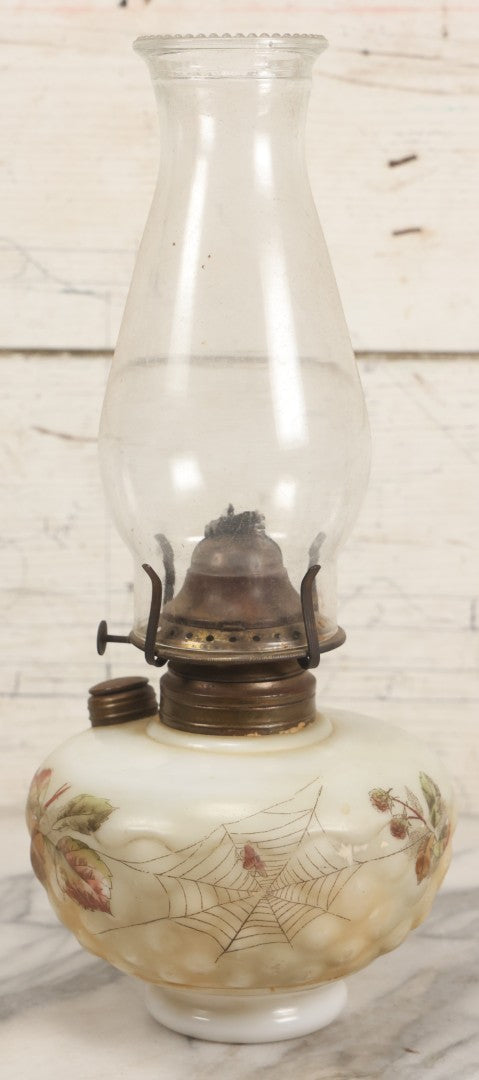Lot 009 - Antique Kerosene Lamp With Milk Glass Font, Transferred Spiderweb And Flower Decoration With Hand Coloring, Font Marked Clark's Patent, With Glass Chimney And Burner, 14-1/4"H