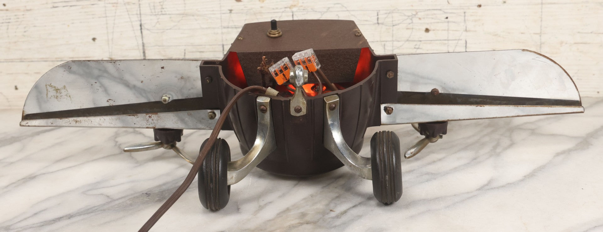 Lot 011 - Vintage Bakelite Airplane Form Clock With Internal Lamp, Note Clock Does Not Work And Both Propellers Missing One Blade