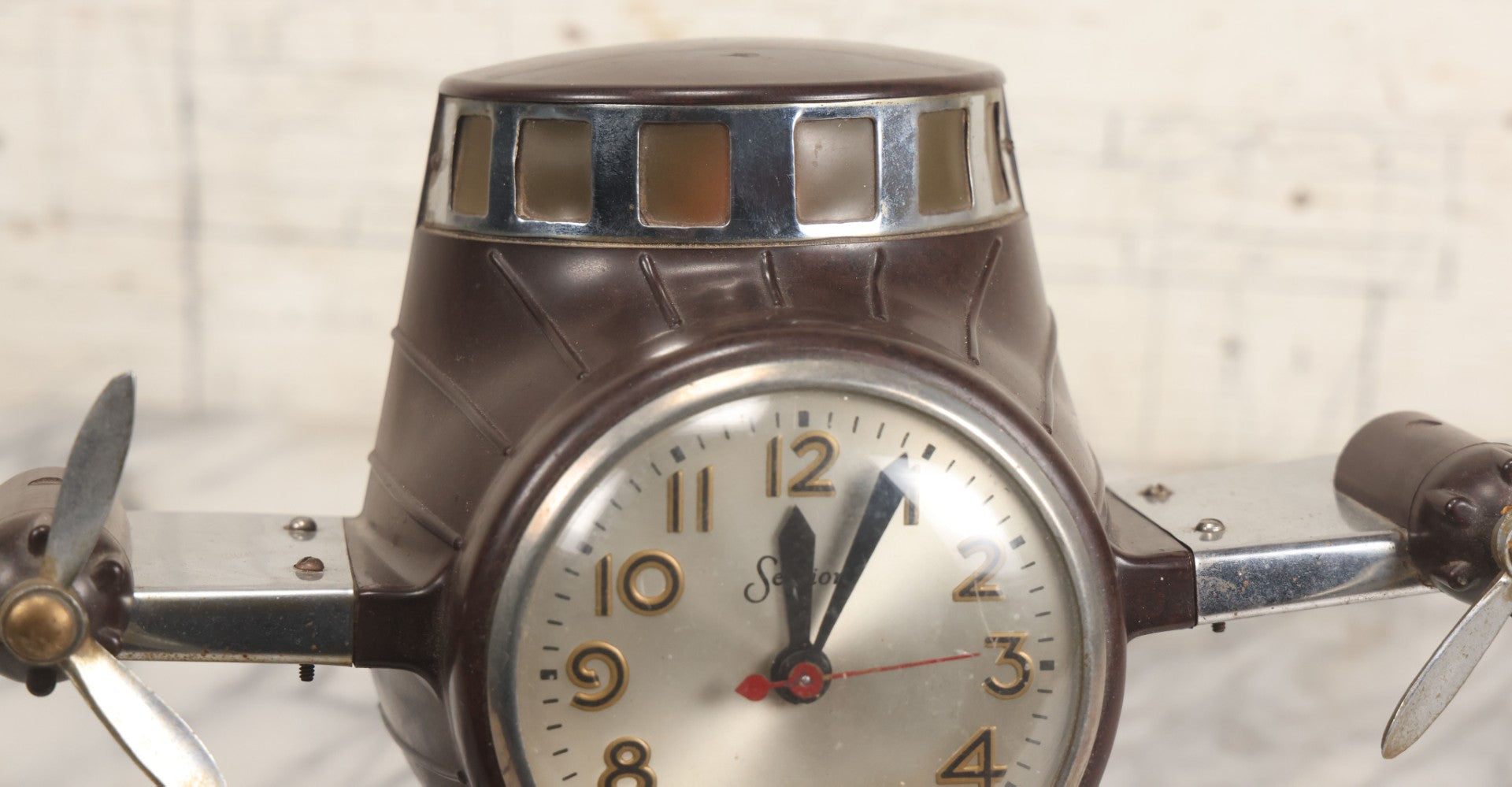 Lot 011 - Vintage Bakelite Airplane Form Clock With Internal Lamp, Note Clock Does Not Work And Both Propellers Missing One Blade