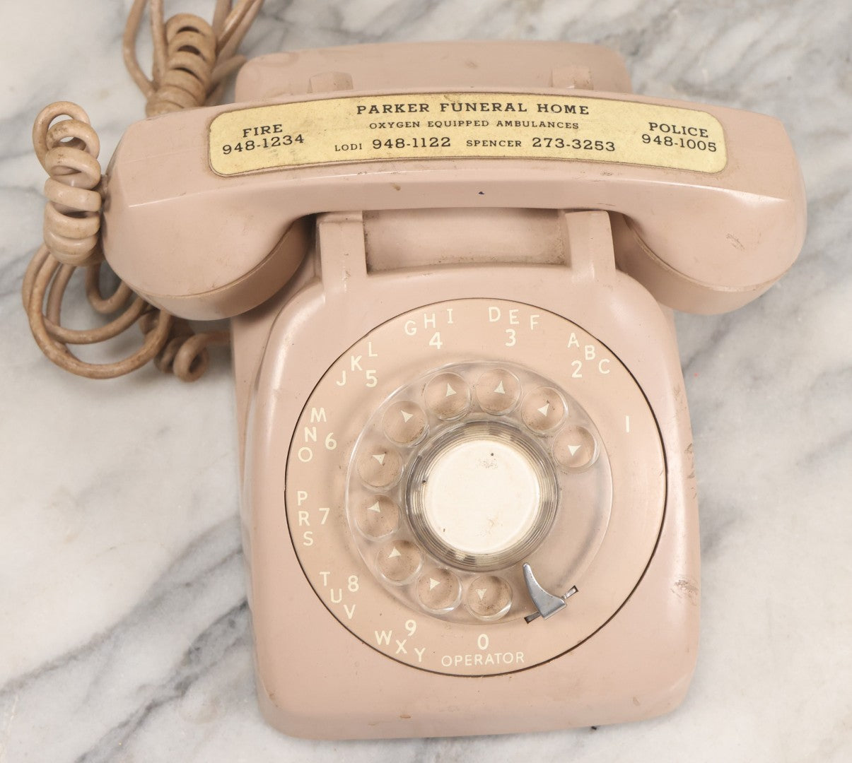 Lot 015 - Vintage Pink Rotary Telephone With Parker Funeral Home Label Advertising Oxygen Equipped Ambulances, Glow In The Dark Label With Numbers For Lodi, Spencer, Police And Fire, Untested
