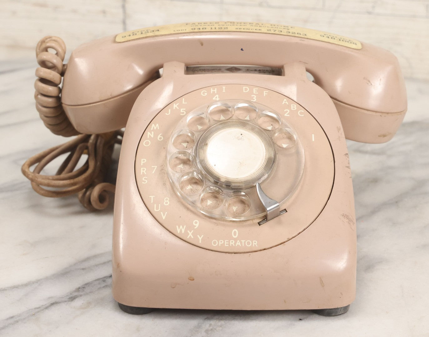 Lot 015 - Vintage Pink Rotary Telephone With Parker Funeral Home Label Advertising Oxygen Equipped Ambulances, Glow In The Dark Label With Numbers For Lodi, Spencer, Police And Fire, Untested