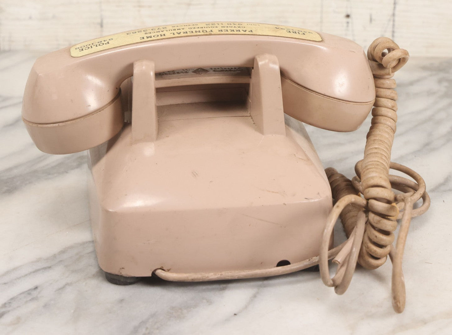 Lot 015 - Vintage Pink Rotary Telephone With Parker Funeral Home Label Advertising Oxygen Equipped Ambulances, Glow In The Dark Label With Numbers For Lodi, Spencer, Police And Fire, Untested