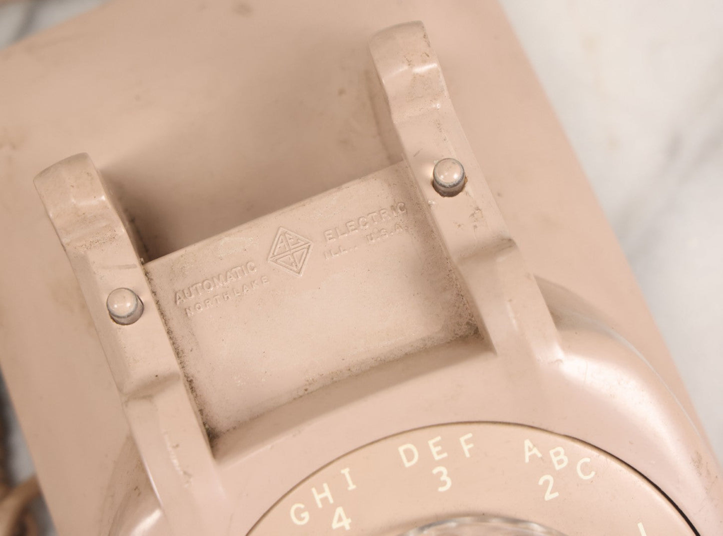 Lot 015 - Vintage Pink Rotary Telephone With Parker Funeral Home Label Advertising Oxygen Equipped Ambulances, Glow In The Dark Label With Numbers For Lodi, Spencer, Police And Fire, Untested