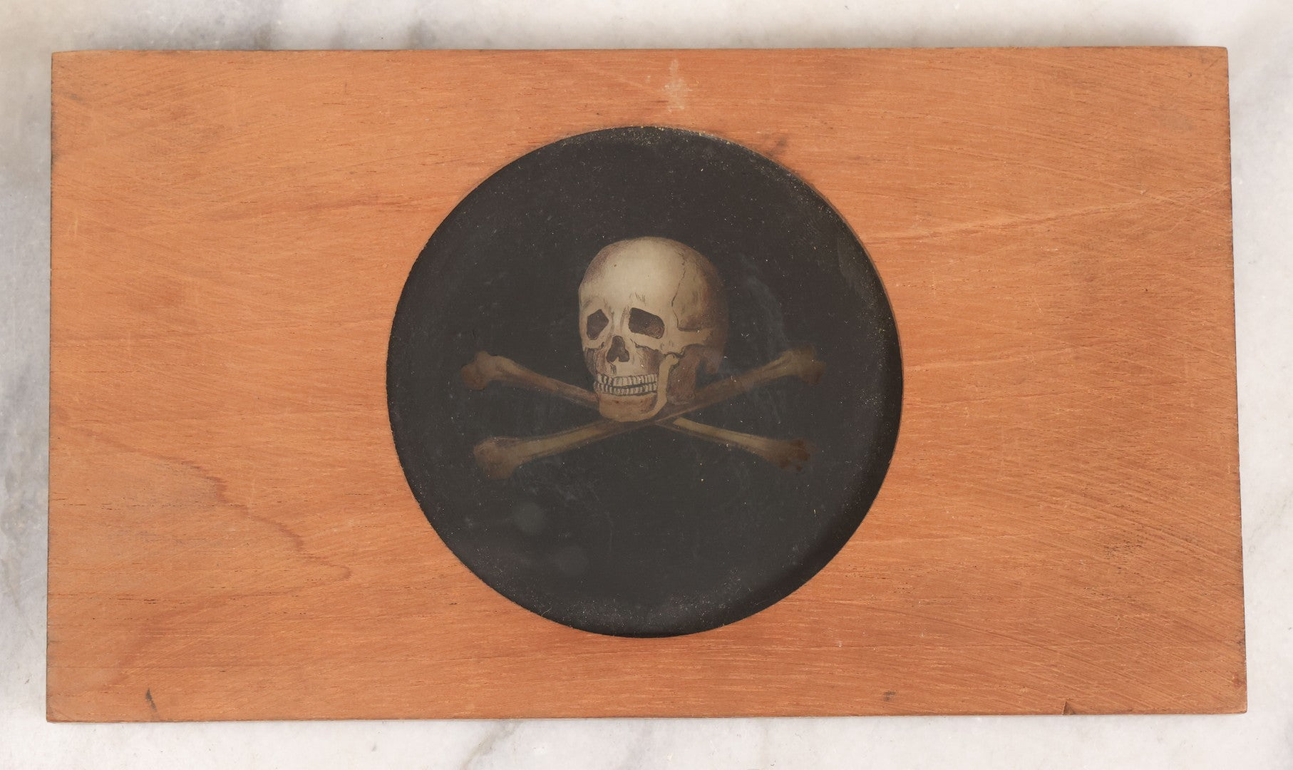 Lot 019 - Antique Hand Colored Odd Fellows I.O.O.F. Magic Lantern Glass Slide With Wood Holder, No. 3 Skull And Cross-Bones, Manufactured By The Henderson-Ames Co., Kalamazoo, Michigan