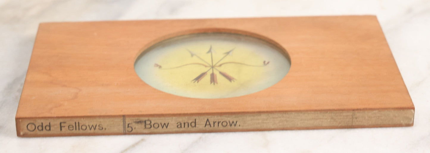 Lot 021 - Antique Hand Colored Odd Fellows I.O.O.F. Magic Lantern Glass Slide With Wood Holder, No. 5 Bow And Arrow, Manufactured By The Henderson-Ames Co., Kalamazoo, Michigan
