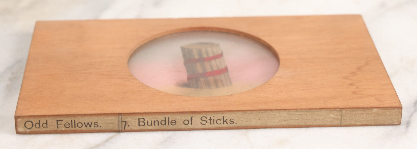 Lot 023 - Antique Hand Colored Odd Fellows I.O.O.F. Magic Lantern Glass Slide With Wood Holder, No. 7 Bundle Of Sticks, Manufactured By The Henderson-Ames Co., Kalamazoo, Michigan