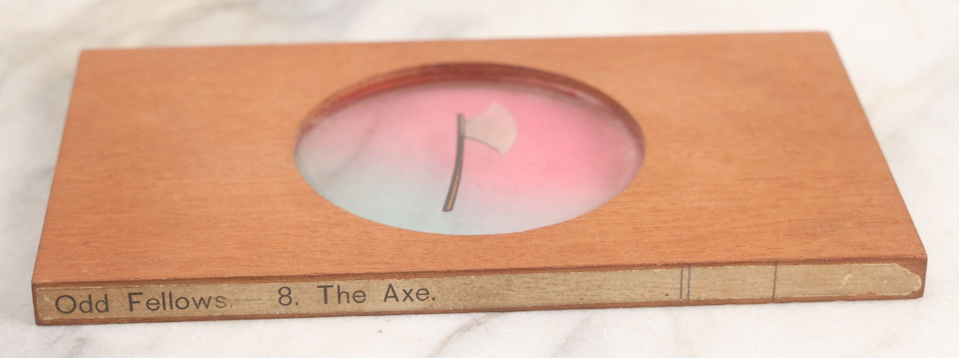 Lot 024 - Antique Hand Colored Odd Fellows I.O.O.F. Magic Lantern Glass Slide With Wood Holder, No. 8 The Axe, Manufactured By The Henderson-Ames Co., Kalamazoo, Michigan