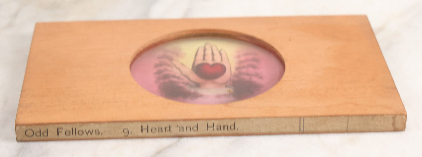 Lot 025 - Antique Hand Colored Odd Fellows I.O.O.F. Magic Lantern Glass Slide With Wood Holder, No. 9 Heart And Hand, Manufactured By The Henderson-Ames Co., Kalamazoo, Michigan