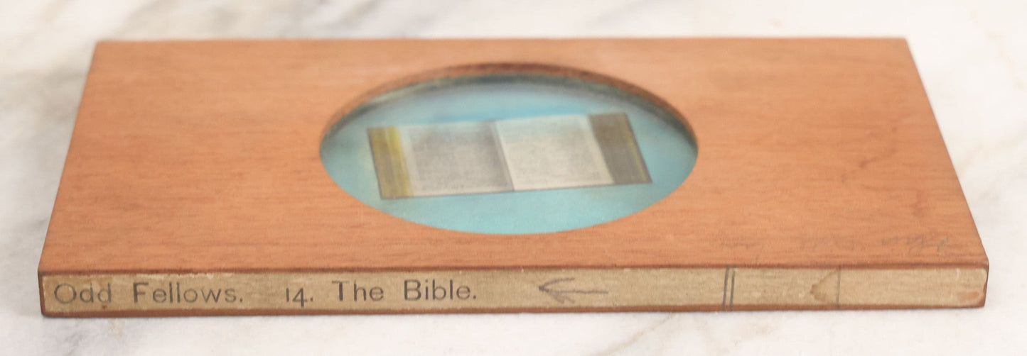 Lot 030 - Antique Hand Colored Odd Fellows I.O.O.F. Magic Lantern Glass Slide With Wood Holder, No. 14 The Bible, Manufactured By The Henderson-Ames Co., Kalamazoo, Michigan