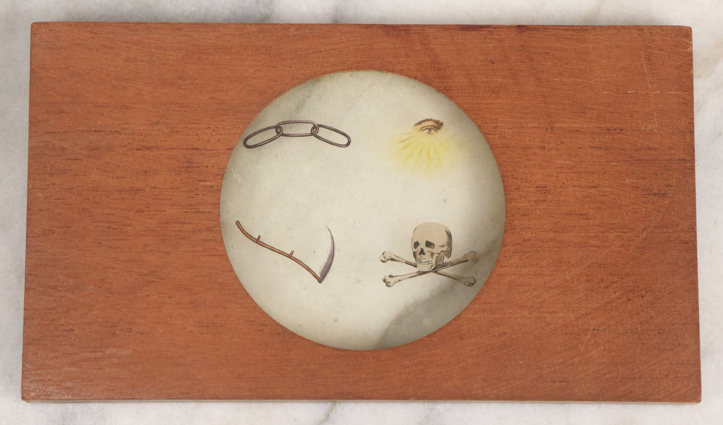 Lot 033 - Antique Hand Colored Odd Fellows I.O.O.F. Magic Lantern Glass Slide With Wood Holder, Initiatory Degree, Depicting The Three Links, Scythe, Skull And Cross-Bones, And All-Seeing Eye, Manufactured By The Henderson-Ames Co., Kalamazoo, Michigan