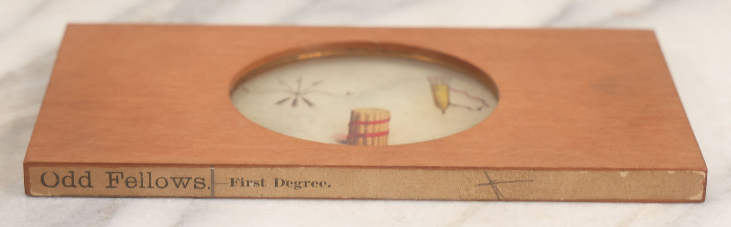 Lot 034 - Antique Hand Colored Odd Fellows I.O.O.F. Magic Lantern Glass Slide With Wood Holder, First Degree, Depicting The Bow And Arrow, Quiver, And Bundle Of Sticks, Manufactured By The Henderson-Ames Co., Kalamazoo, Michigan