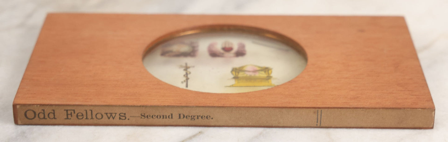 Lot 035 - Antique Hand Colored Odd Fellows I.O.O.F. Magic Lantern Glass Slide With Wood Holder, Second Degree, Depicting The Globe, Heart And Hand, Serpent, And Ark, Manufactured By The Henderson-Ames Co., Kalamazoo, Michigan