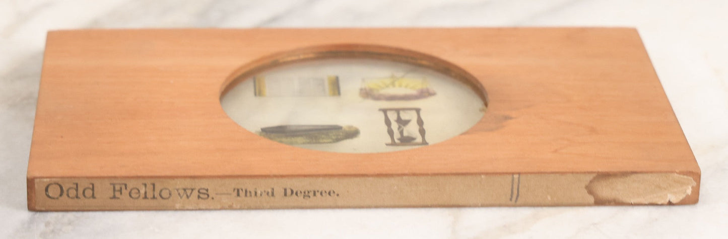 Lot 039 - Antique Hand Colored Odd Fellows I.O.O.F. Magic Lantern Glass Slide With Wood Holder, Third Degree, Depicting The Bible, Scales, Hour Glass, And Coffin, Manufactured By The Henderson-Ames Co., Kalamazoo, Michigan