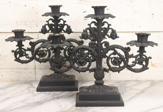 Lot 041 - Vintage Pair Of Ornate Cast Aluminum Three-Arm Candelabra With Scrolling Foliate Design And Square Plinth Bases, Painted Black, Reproductions Of Earlier Designs, 13-1/2" H Each