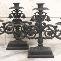 Lot 041 - Vintage Pair Of Ornate Cast Aluminum Three-Arm Candelabra With Scrolling Foliate Design And Square Plinth Bases, Painted Black, Reproductions Of Earlier Designs, 13-1/2" H Each