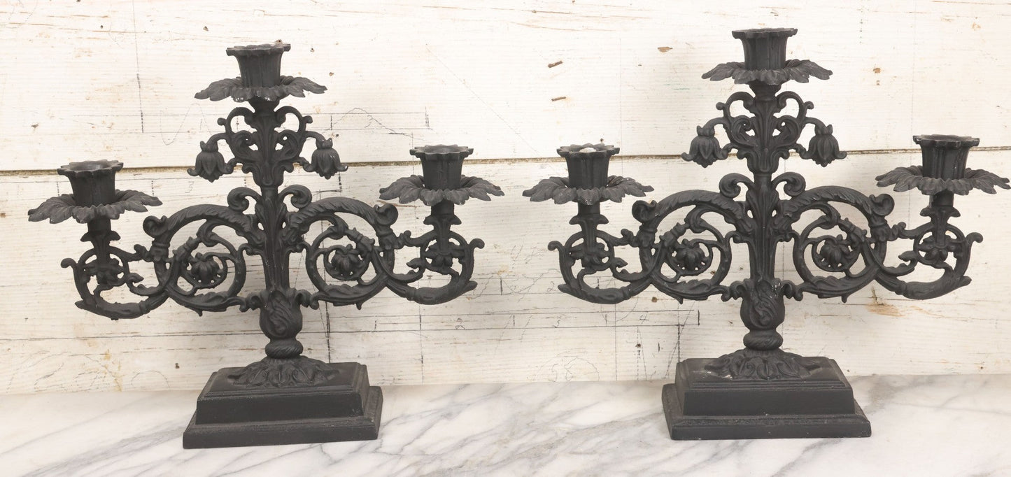 Lot 041 - Vintage Pair Of Ornate Cast Aluminum Three-Arm Candelabra With Scrolling Foliate Design And Square Plinth Bases, Painted Black, Reproductions Of Earlier Designs, 13-1/2" H Each