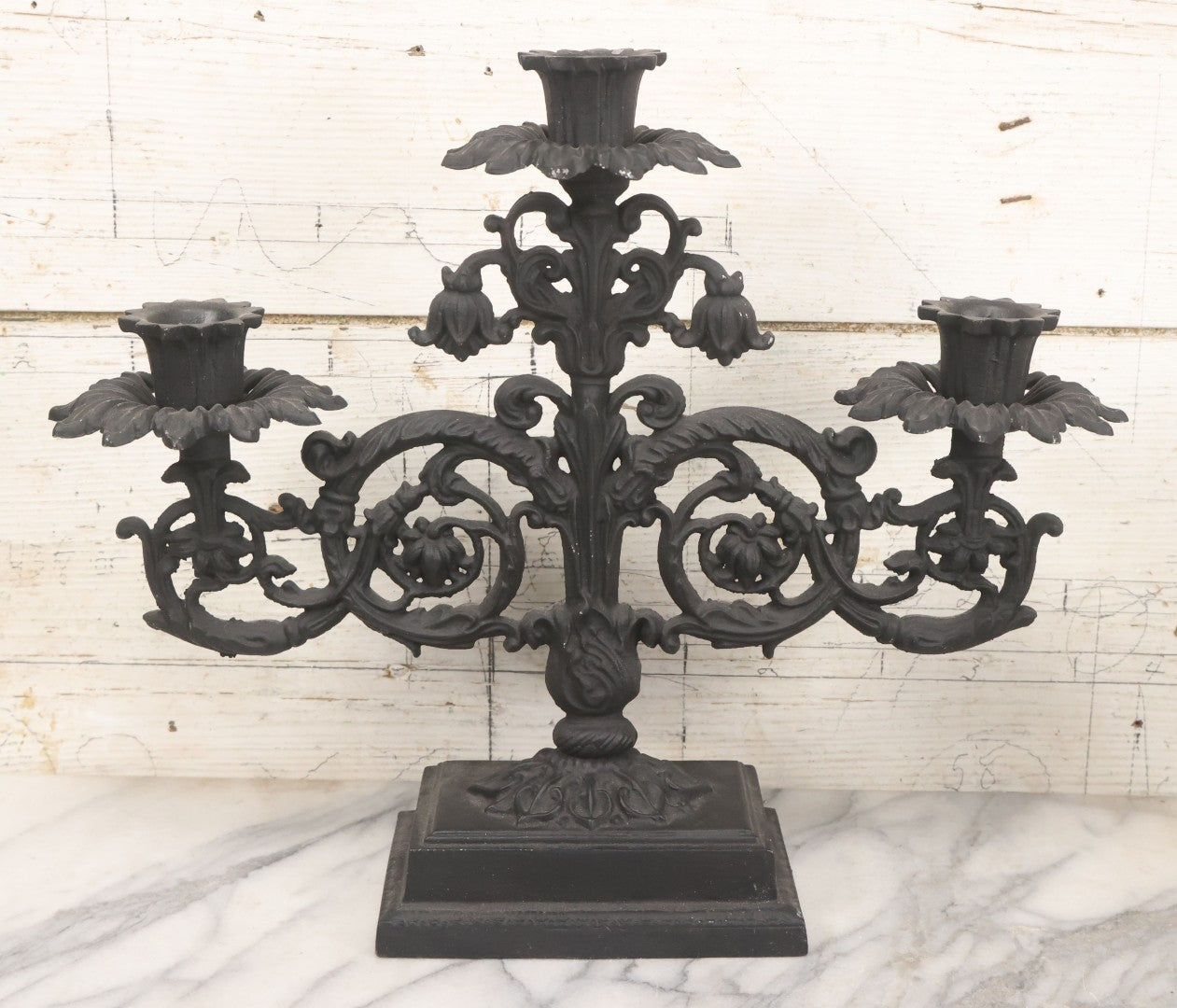Lot 041 - Vintage Pair Of Ornate Cast Aluminum Three-Arm Candelabra With Scrolling Foliate Design And Square Plinth Bases, Painted Black, Reproductions Of Earlier Designs, 13-1/2" H Each