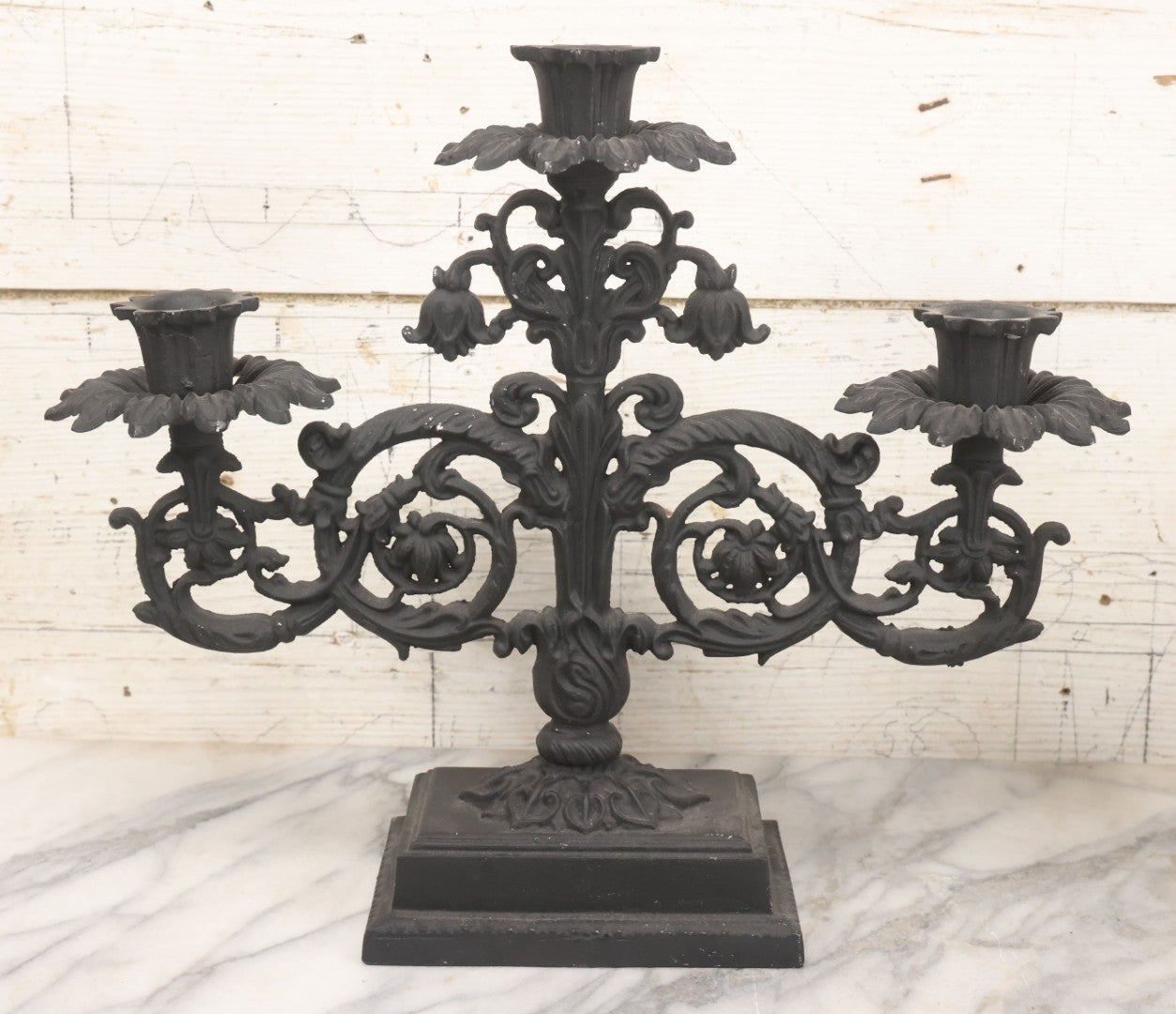 Lot 041 - Vintage Pair Of Ornate Cast Aluminum Three-Arm Candelabra With Scrolling Foliate Design And Square Plinth Bases, Painted Black, Reproductions Of Earlier Designs, 13-1/2" H Each
