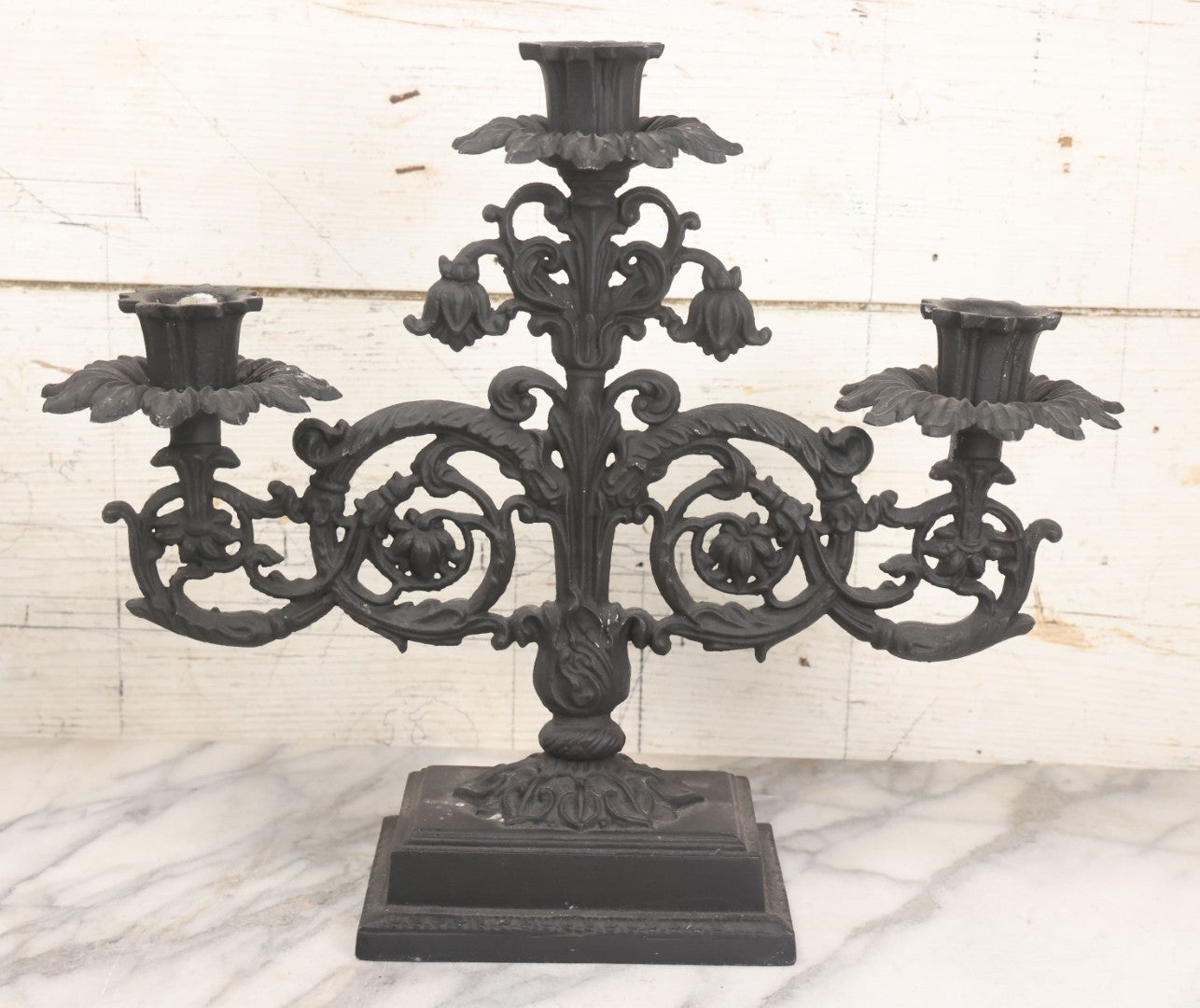 Lot 041 - Vintage Pair Of Ornate Cast Aluminum Three-Arm Candelabra With Scrolling Foliate Design And Square Plinth Bases, Painted Black, Reproductions Of Earlier Designs, 13-1/2" H Each
