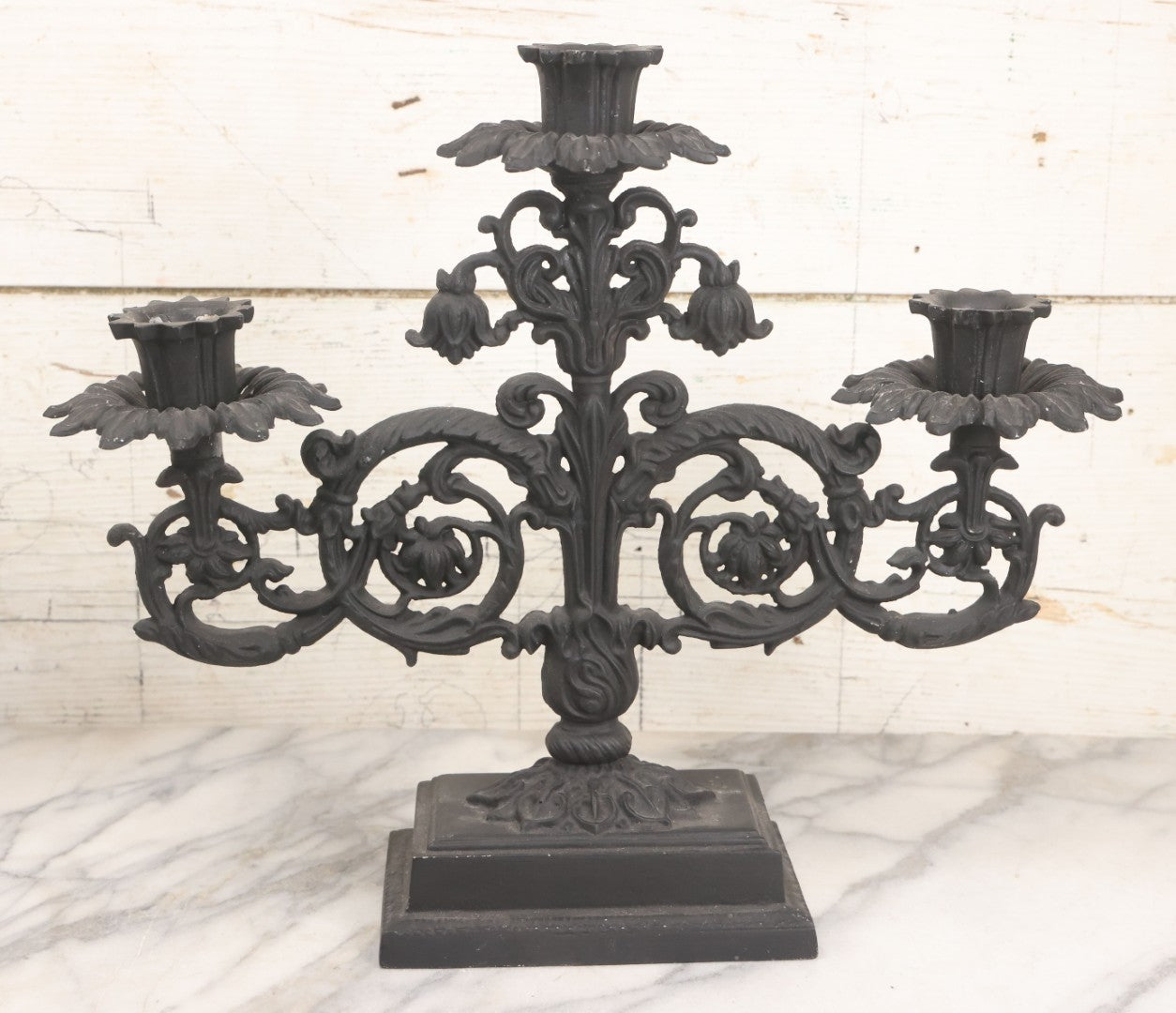Lot 041 - Vintage Pair Of Ornate Cast Aluminum Three-Arm Candelabra With Scrolling Foliate Design And Square Plinth Bases, Painted Black, Reproductions Of Earlier Designs, 13-1/2" H Each