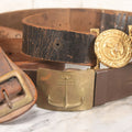 Lot 060 - Trio Of Antique Leather Belts Including Brass Anchor Buckle, Brass Eagle-And-Anchor Buckle, And Belt Marked “Sgt. Standish, Co. L. 182nd Inf.”