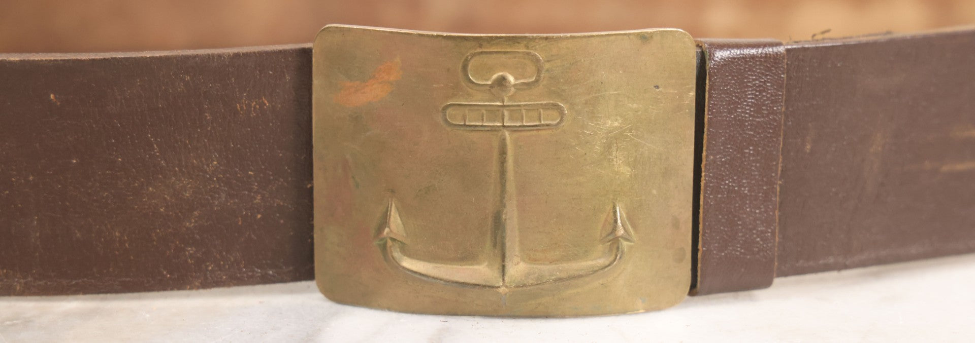 Lot 060 - Trio Of Antique Leather Belts Including Brass Anchor Buckle, Brass Eagle-And-Anchor Buckle, And Belt Marked “Sgt. Standish, Co. L. 182nd Inf.”