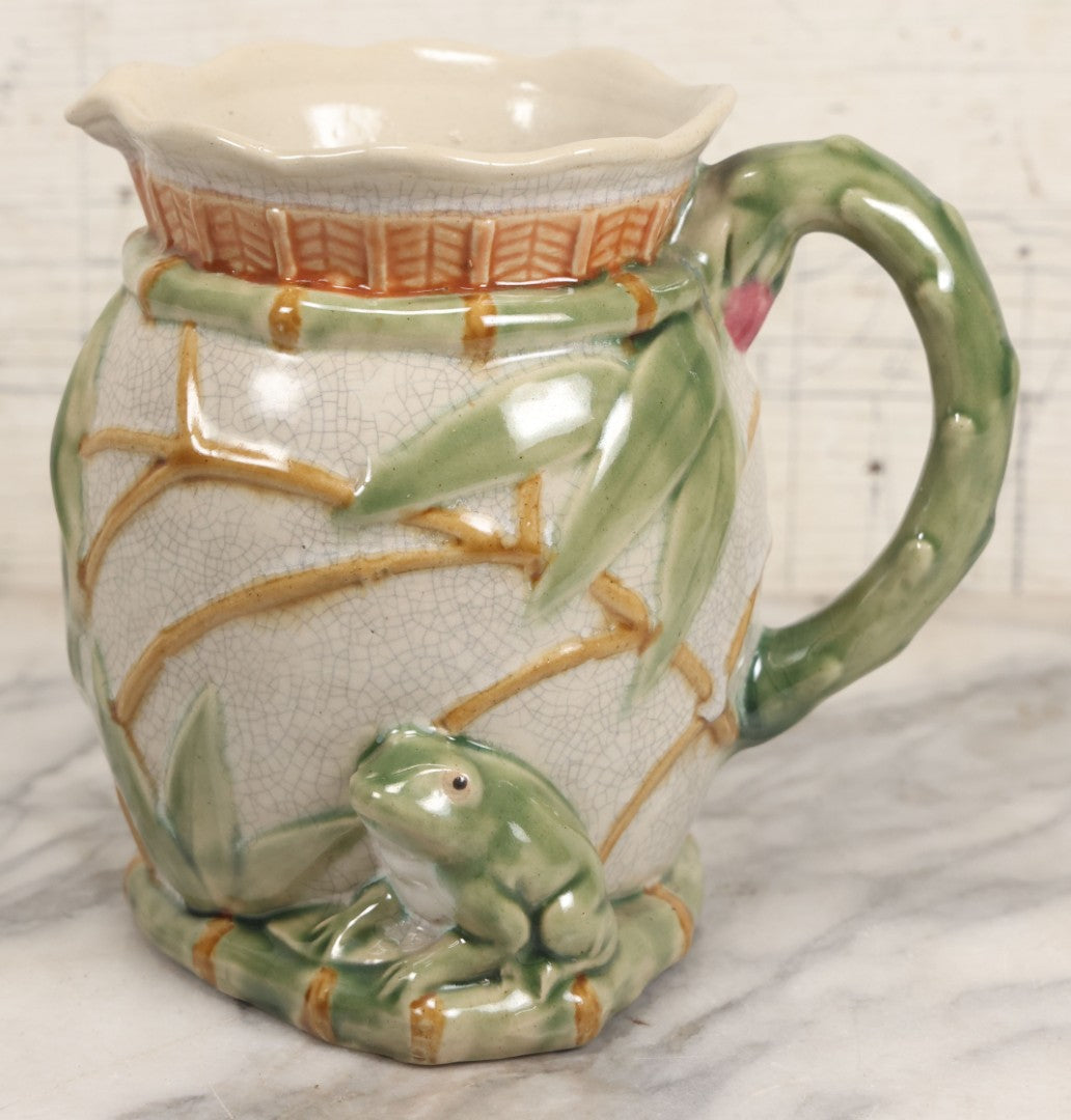 Lot 070 - Vintage Majolica Ceramic Jug With Bamboo And Lilypad Motifs, Craquelure Finish, Figural Frog At Base, 7" H