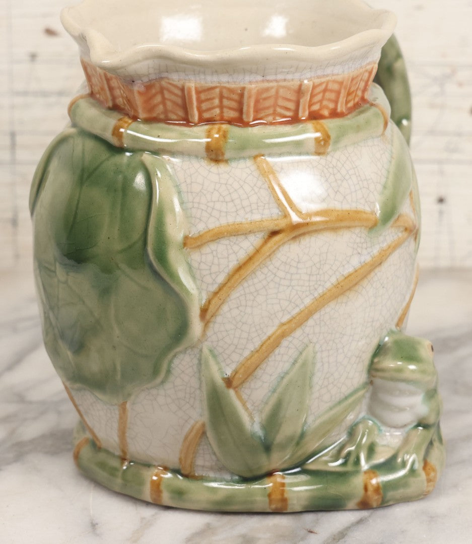 Lot 070 - Vintage Majolica Ceramic Jug With Bamboo And Lilypad Motifs, Craquelure Finish, Figural Frog At Base, 7" H