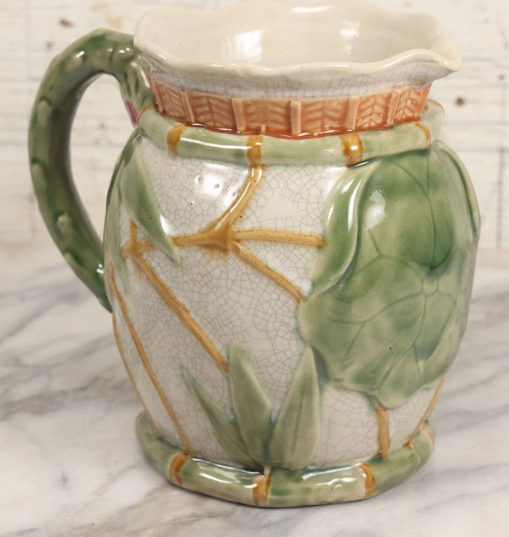 Lot 070 - Vintage Majolica Ceramic Jug With Bamboo And Lilypad Motifs, Craquelure Finish, Figural Frog At Base, 7" H