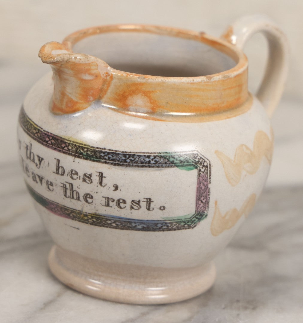 Lot 076 - Antique Hand Colored Transferware Creamer With "Do Thy Best, And Leave The Rest." Motto, Metallic Orange Paint On Sides, Handle And Rim, Unmarked, 3-3/8" H