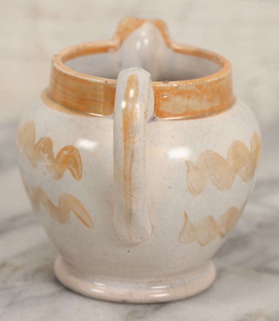 Lot 076 - Antique Hand Colored Transferware Creamer With "Do Thy Best, And Leave The Rest." Motto, Metallic Orange Paint On Sides, Handle And Rim, Unmarked, 3-3/8" H