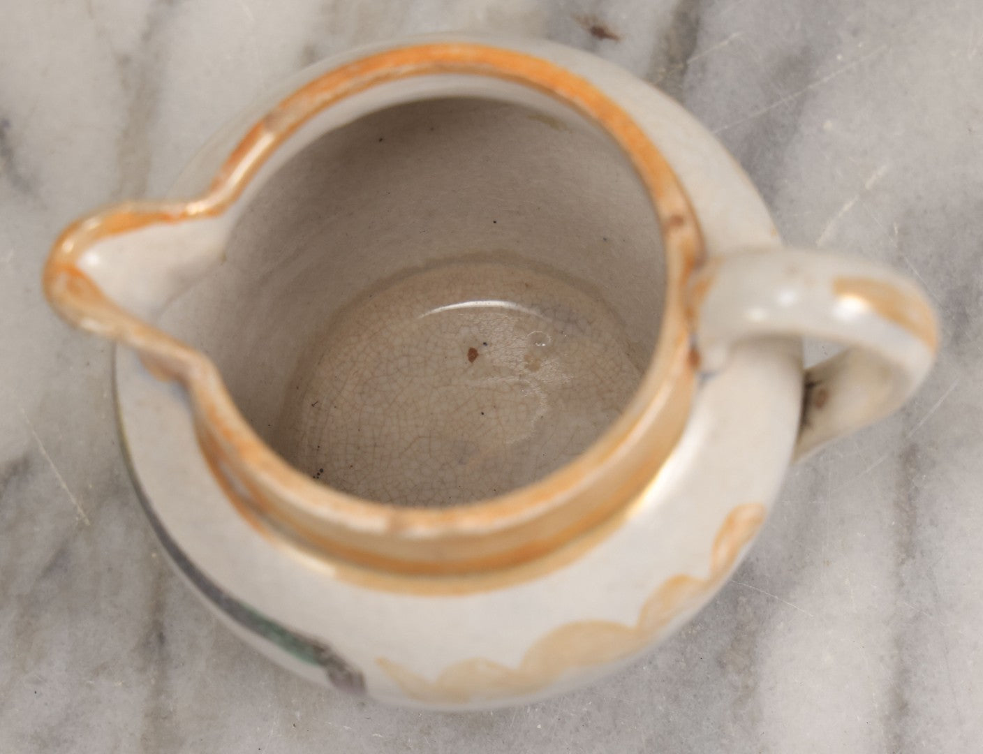 Lot 076 - Antique Hand Colored Transferware Creamer With "Do Thy Best, And Leave The Rest." Motto, Metallic Orange Paint On Sides, Handle And Rim, Unmarked, 3-3/8" H