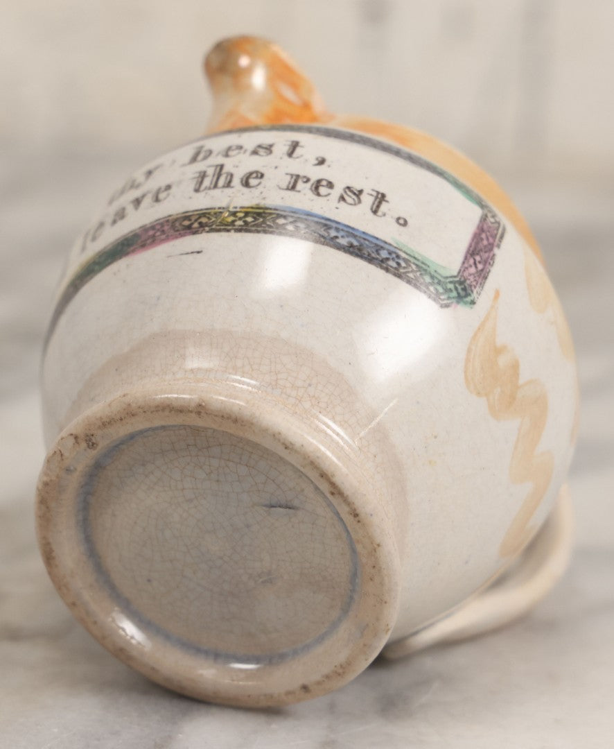 Lot 076 - Antique Hand Colored Transferware Creamer With "Do Thy Best, And Leave The Rest." Motto, Metallic Orange Paint On Sides, Handle And Rim, Unmarked, 3-3/8" H