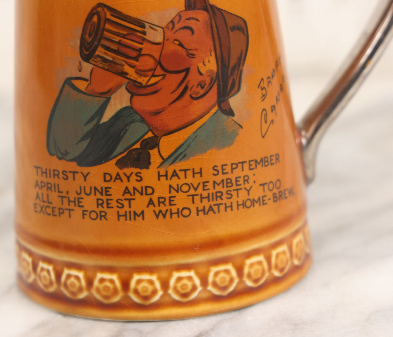 Lot 079 - Vintage Pottery Stein With "Home-Brew" Verse With Beer Chugging Man And "What's Yours?" Illustration On Verso, Metallic Painted Lip And Handle, Stamped Makers Mark Lord Nelson Pottery, England On Bottom, 5-1/4" H