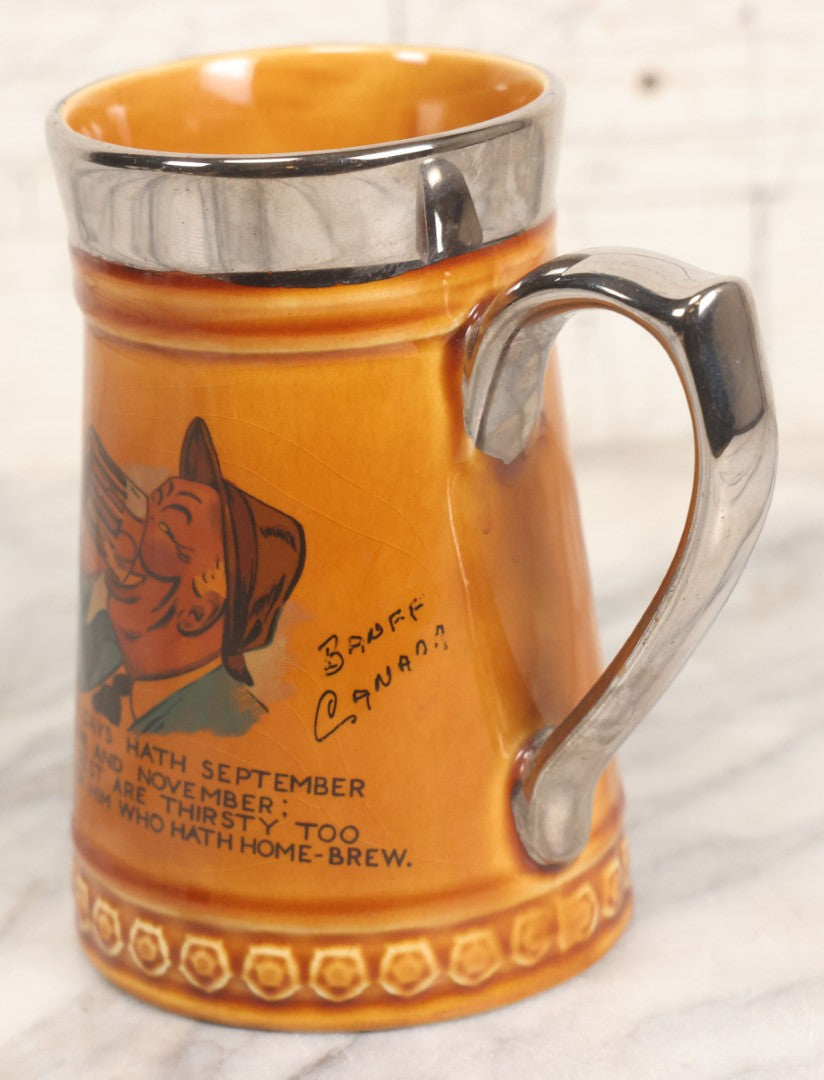 Lot 079 - Vintage Pottery Stein With "Home-Brew" Verse With Beer Chugging Man And "What's Yours?" Illustration On Verso, Metallic Painted Lip And Handle, Stamped Makers Mark Lord Nelson Pottery, England On Bottom, 5-1/4" H