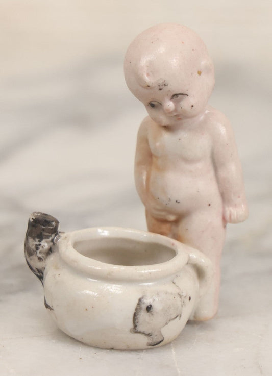 Lot 082 - Vintage Miniature Porcelain Baby Chamber Pot Figurine With Baby Looking Down At Potty And Mouse Crawling Out, Marked Made In Occupied Japan, 2-1/2" H