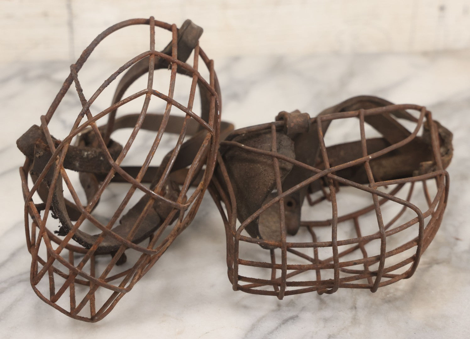 Lot 084 - Pair Of Antique Metal Cage Dog Muzzles With Leather Straps