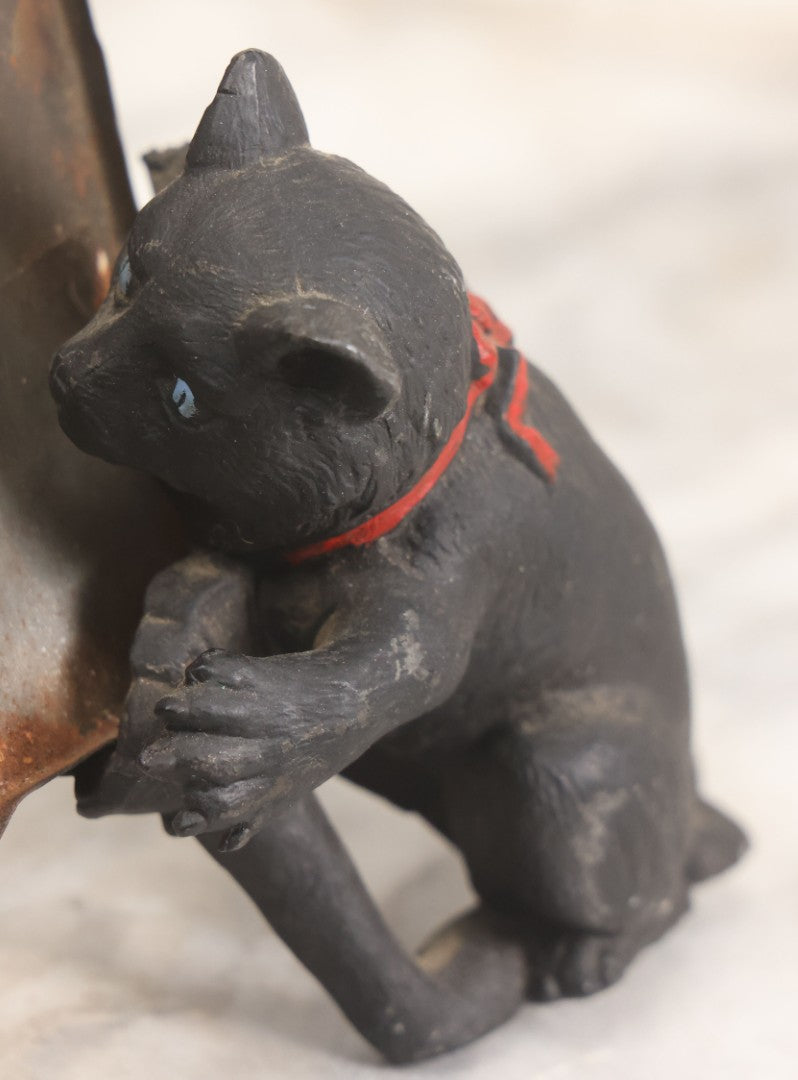 Lot 085 - Antique Cast Iron Cat Frame With Three Cats And Red Bow Detail, Note Damage