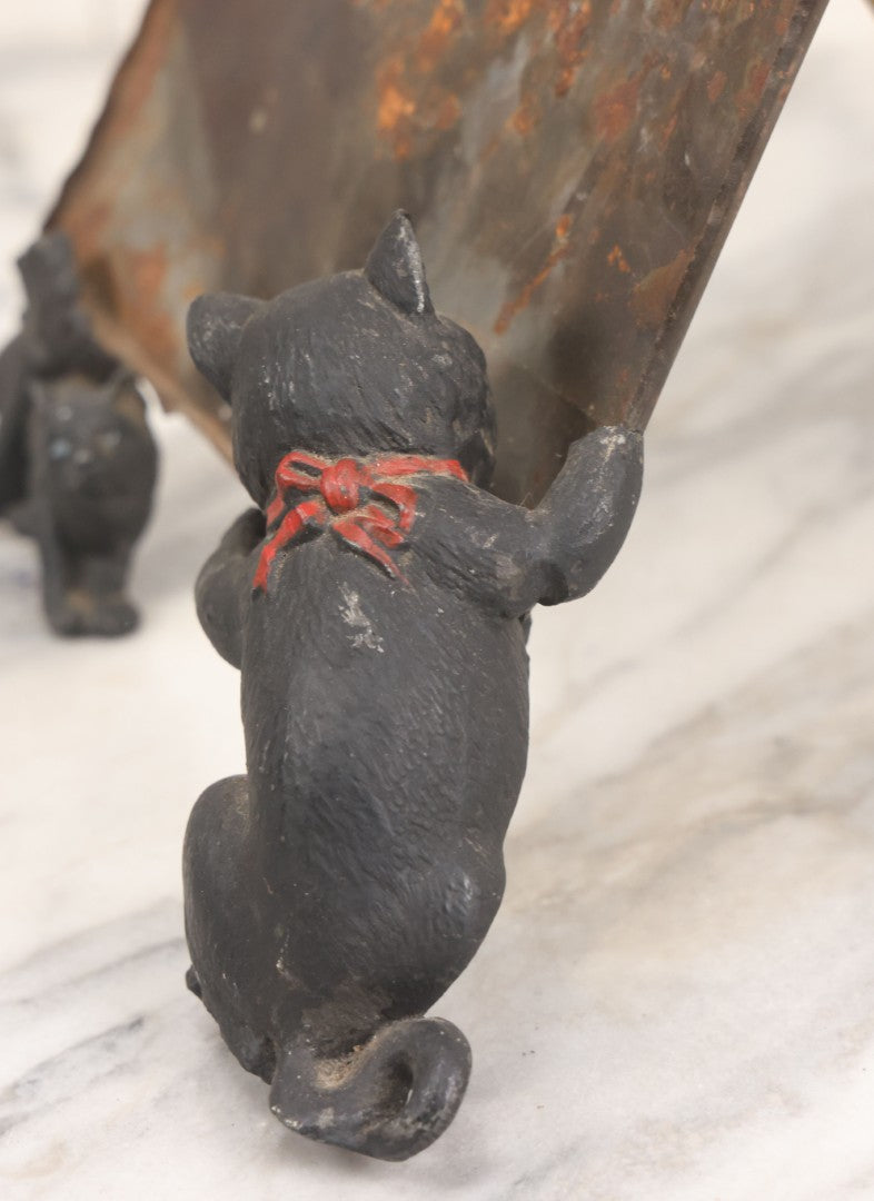 Lot 085 - Antique Cast Iron Cat Frame With Three Cats And Red Bow Detail, Note Damage